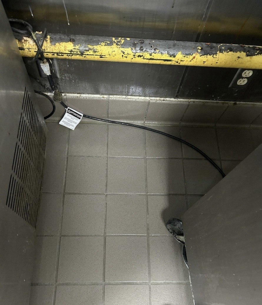 Same kitchen corner after GLAZE deep cleaning — spotless tile and equipment