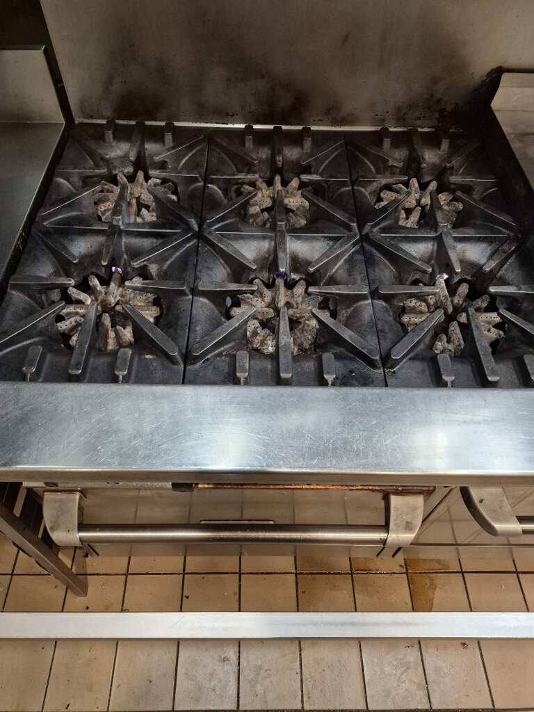 Commercial stove top burners after detailed cleaning