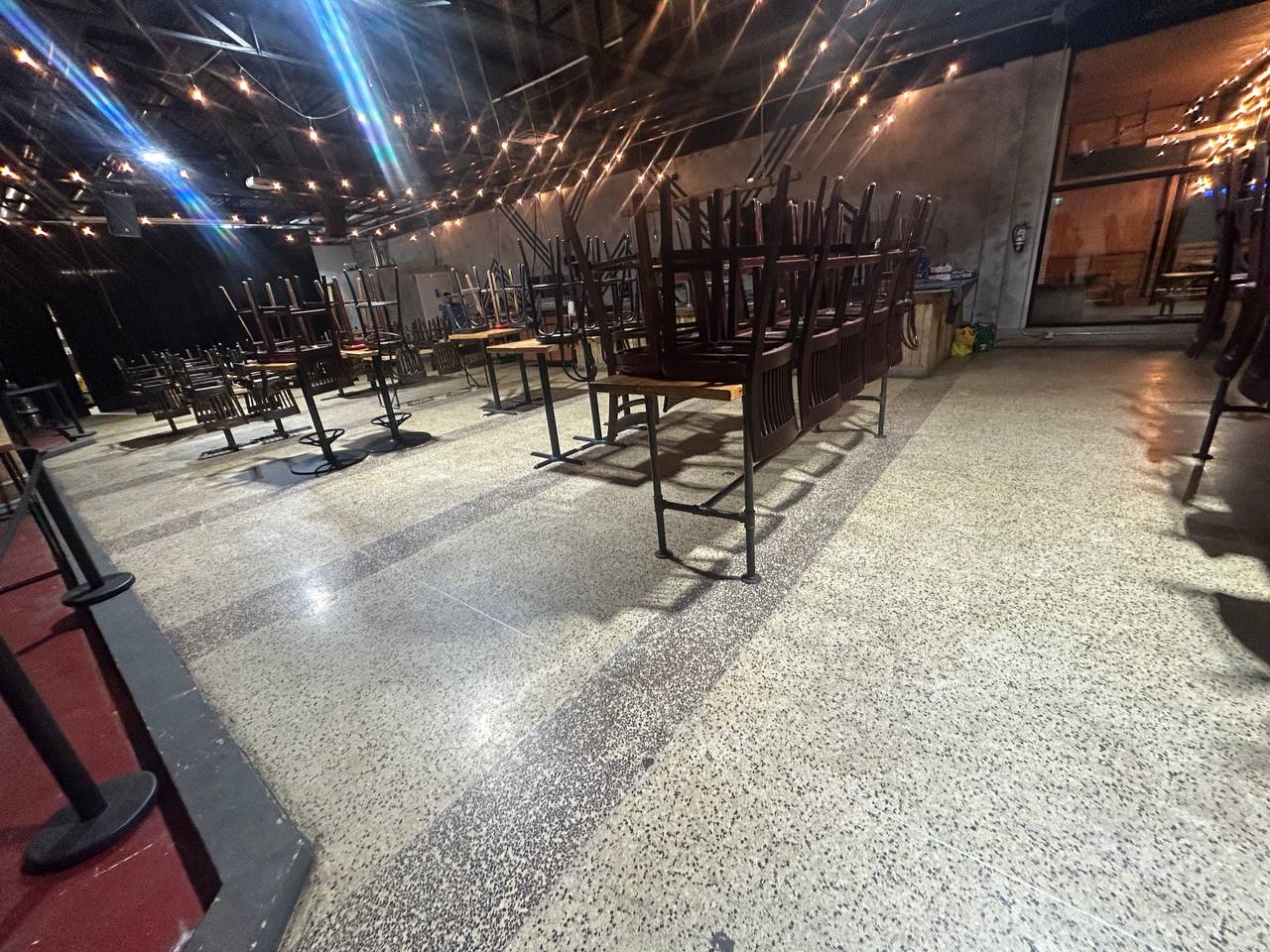 Large venue floor cleaned and maintained